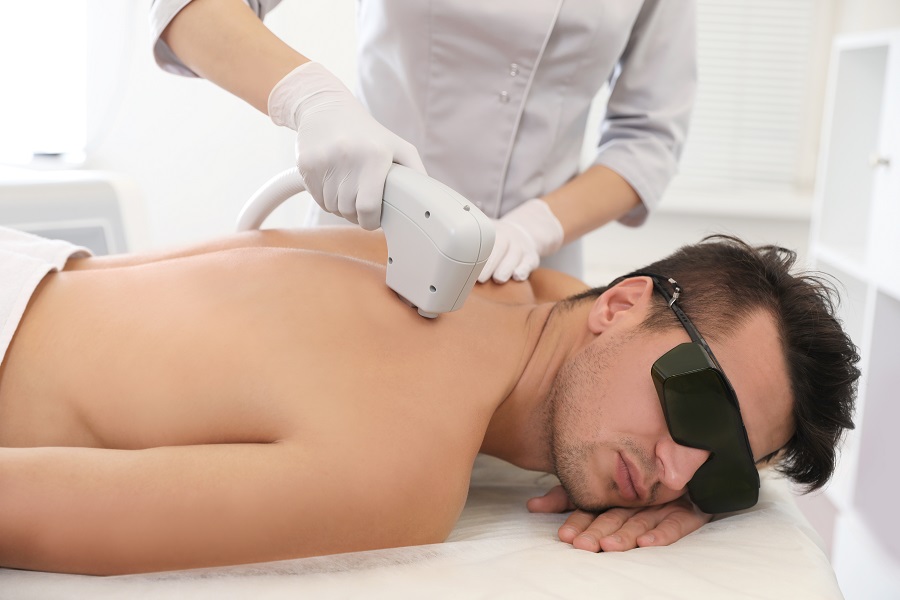 Young,Man,Undergoing,Laser,Epilation,Procedure,In,Beauty,Salon